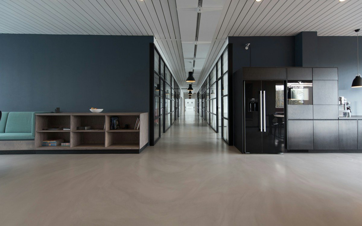 High-traffic communal atrium and polished hard flooring maintained with professional rotary scrubbing and buffer care