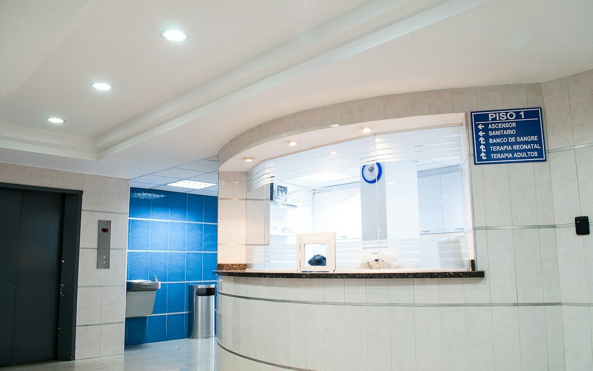 Immaculate patient waiting area and reception lobby in modern dental practice meeting CQC premises hygiene standards